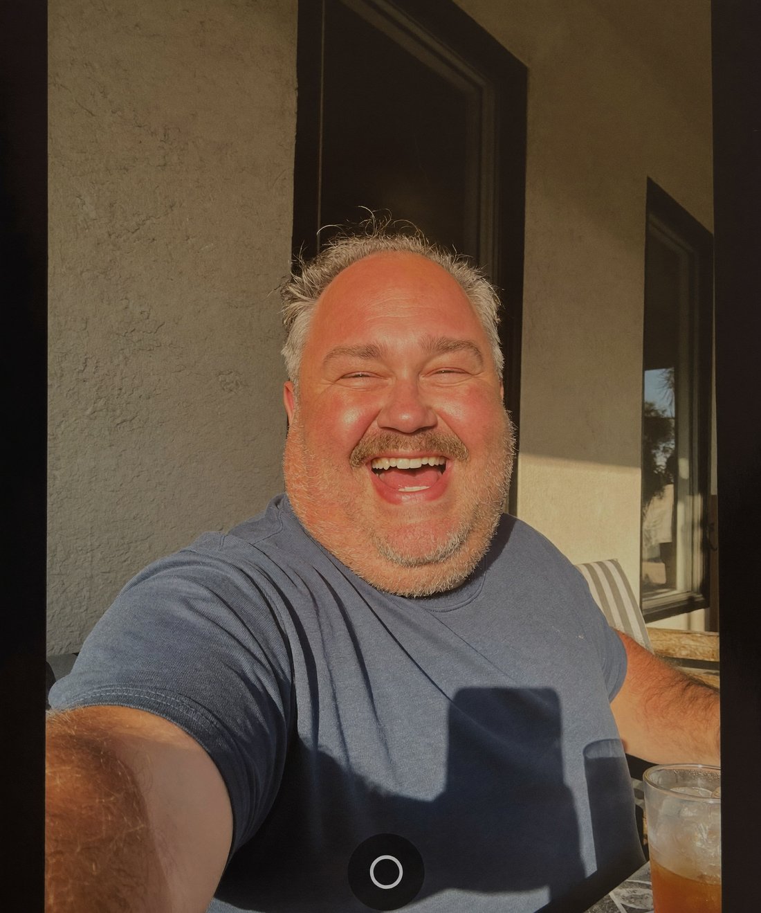 Cheerful man on his porch